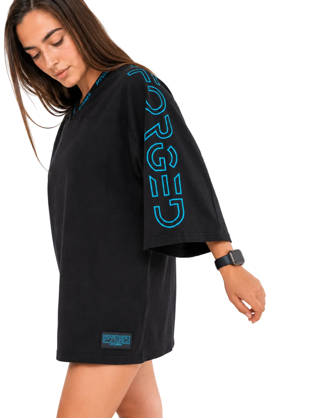 A woman wearing a black oversized short-sleeve t-shirt with a bright blue vertical 'BURGA' logo printed on the sleeve, photographed against a clean white background.