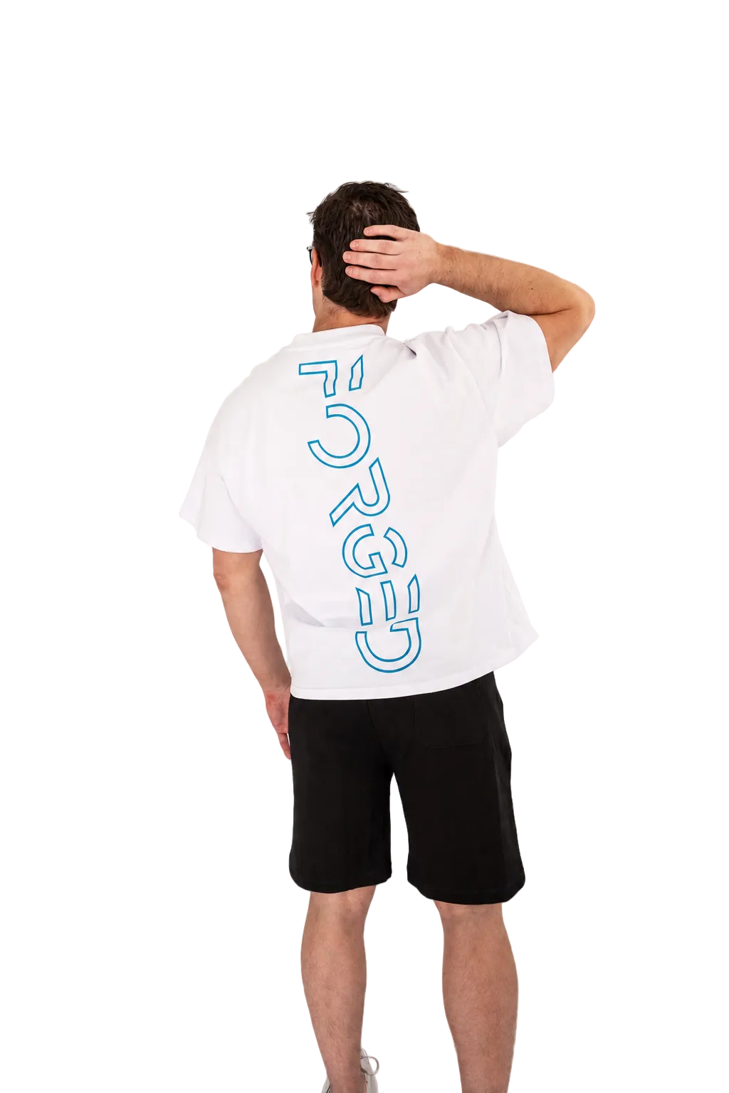 A man shown from behind wearing a white t-shirt with a large blue outlined vertical 'FORGED' logo on the back, paired with black shorts, against a plain white studio background.